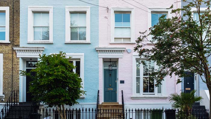 Colorful facades of residential buildings of west london, famous for its pastel-colored victorian houses